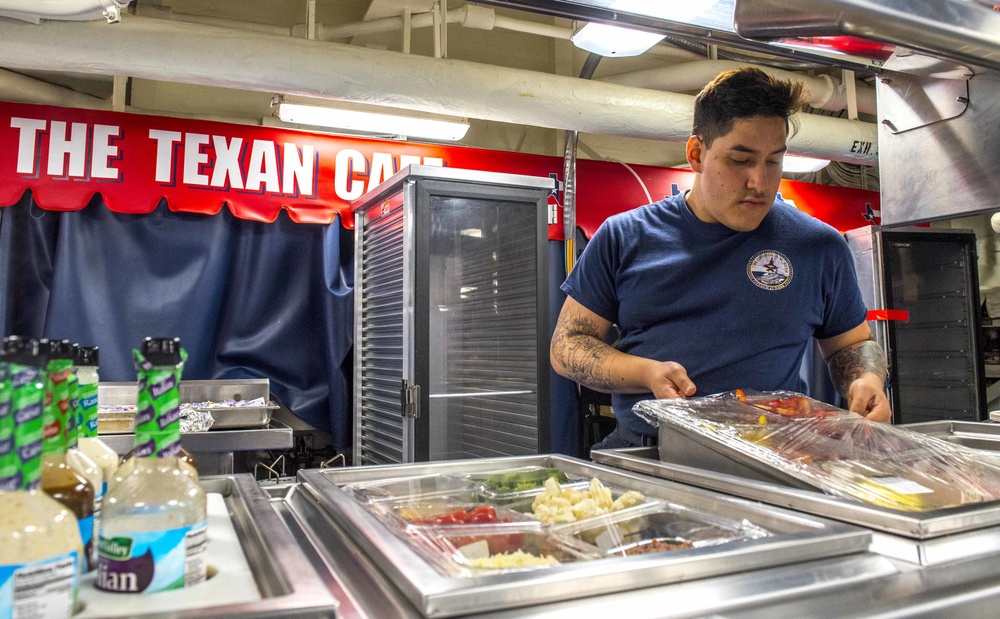 Sailor Prepares Salad Bar