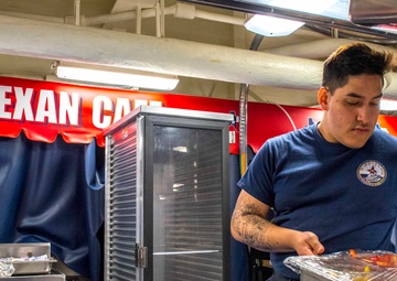 Sailor Prepares Salad Bar