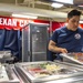 Sailor Prepares Salad Bar