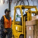 Sailor Escorts Forklift With Supplies