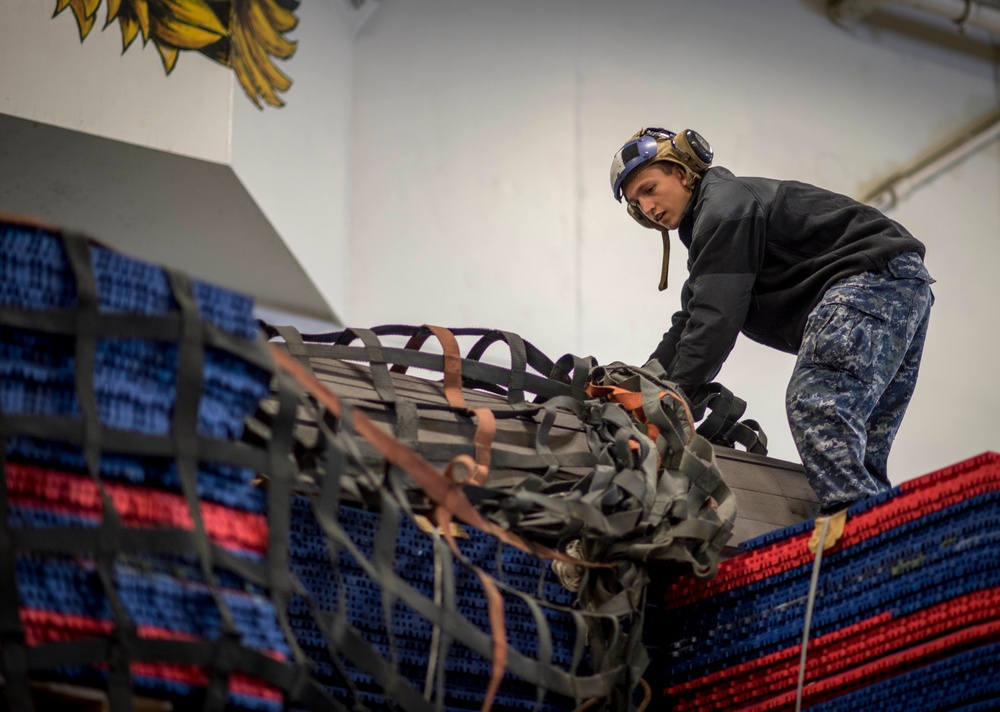 Sailor Removes Cargo Net