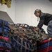 Sailor Removes Cargo Net