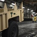 Airman guides trailer into C-17 in support of Operation Faithful Patriot