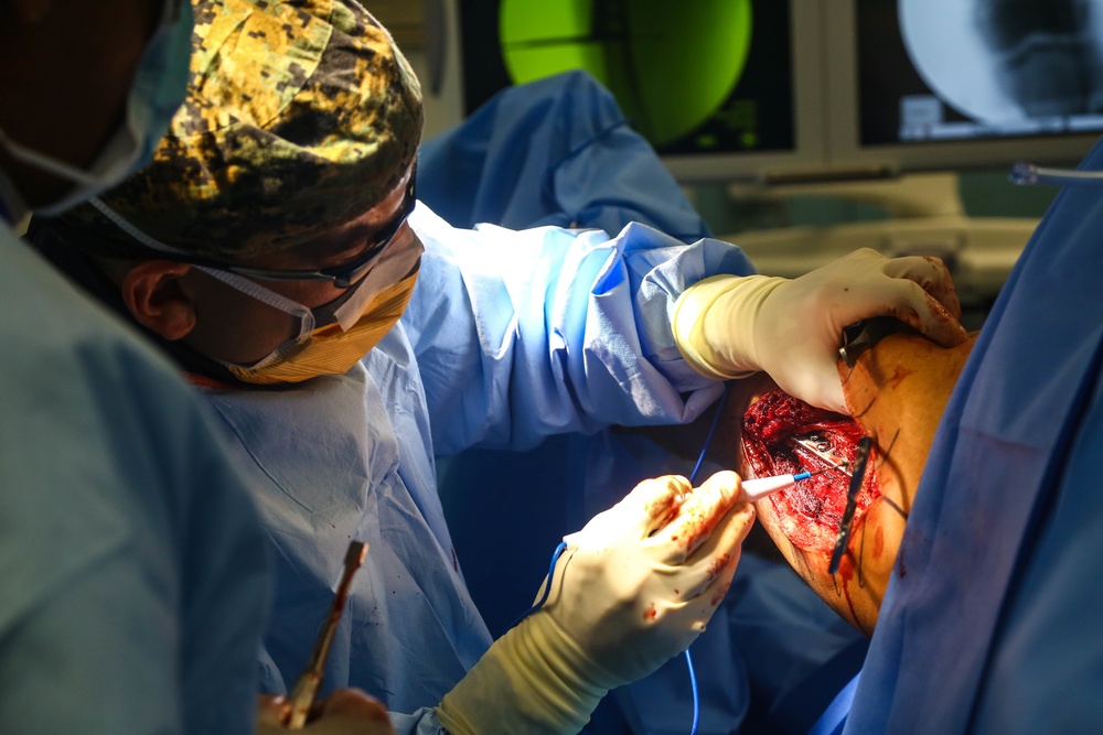USNS Comfort Personnel Preform Surgery on Patients