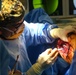 USNS Comfort Personnel Preform Surgery on Patients