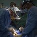 USNS Comfort Personnel Preform Surgery on Patients