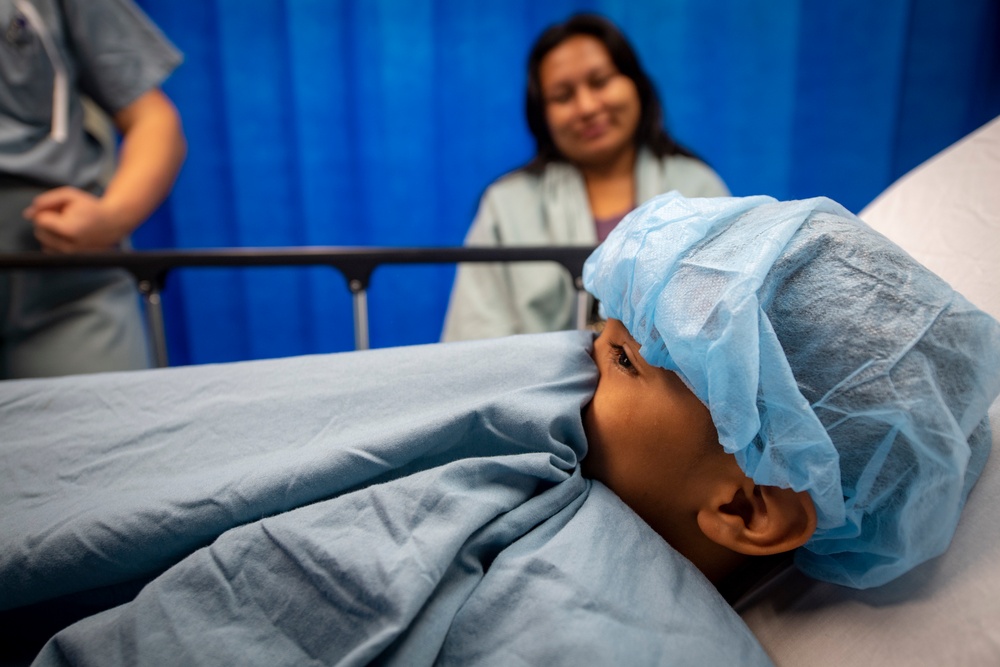 USNS Comfort Personnel Preform Surgery on Patients