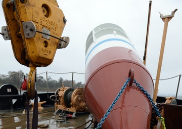 Coast Guard Cutter Bluebell sets mooring buoy at Tongue Point