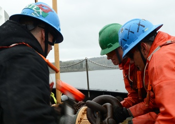 Coast Guard Cutter Bluebell sets a mooring buoy at Tongue Point