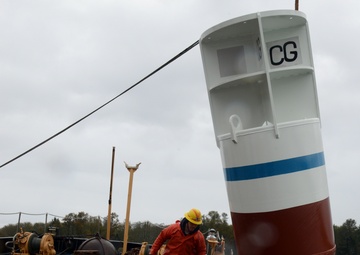 Coast Guard Cutter Bluebell sets a mooring buoy at Tongue Point