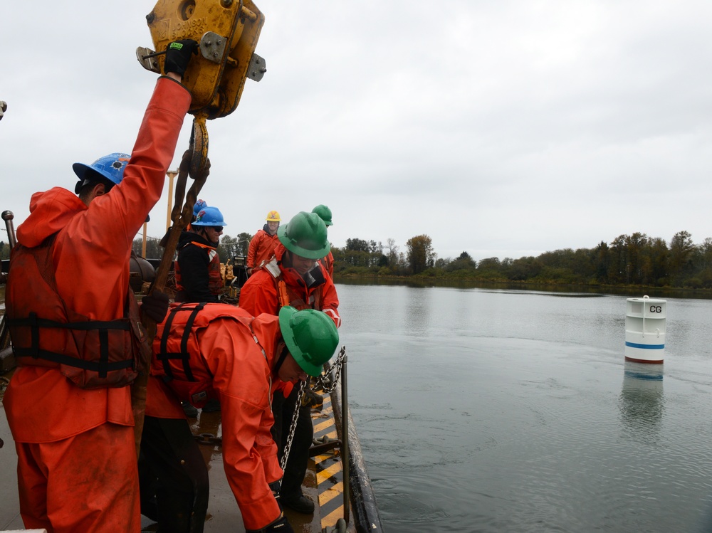 Coast Guard Cutter Bluebell sets a mooring buoy at Tongue Point