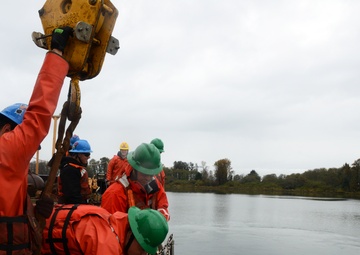 Coast Guard Cutter Bluebell sets a mooring buoy at Tongue Point