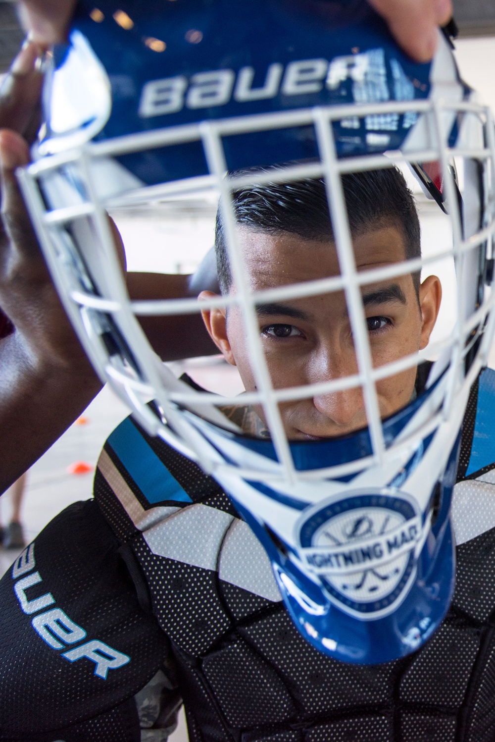 Hangar turned hockey rink: Tampa Bay Lightning, MacDill service members play hockey