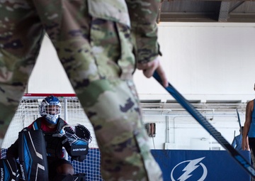 Hangar turned hockey rink: Tampa Bay Lightning, MacDill service members play hockey