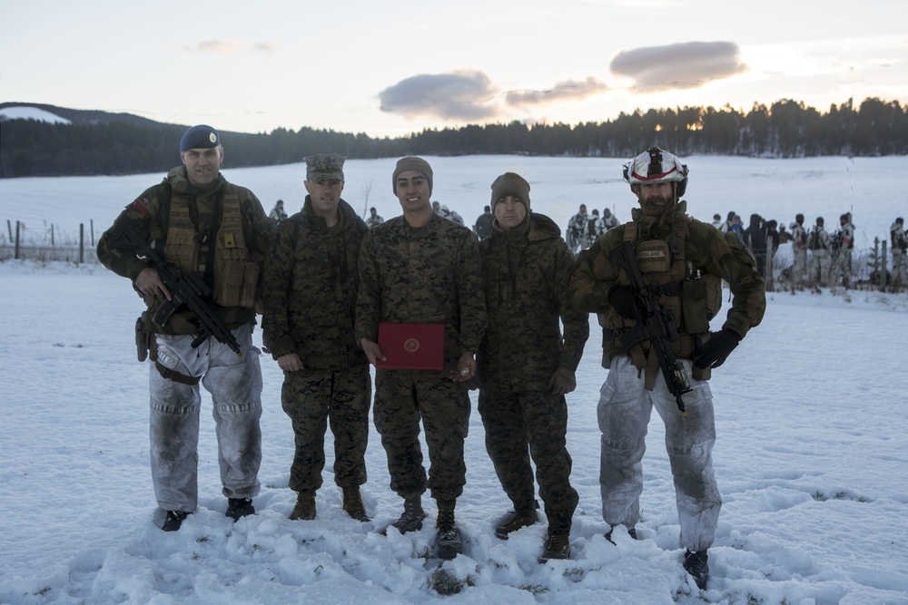 Norwegian Commander Pins U.S. Marine To The Rank Of Sergeant