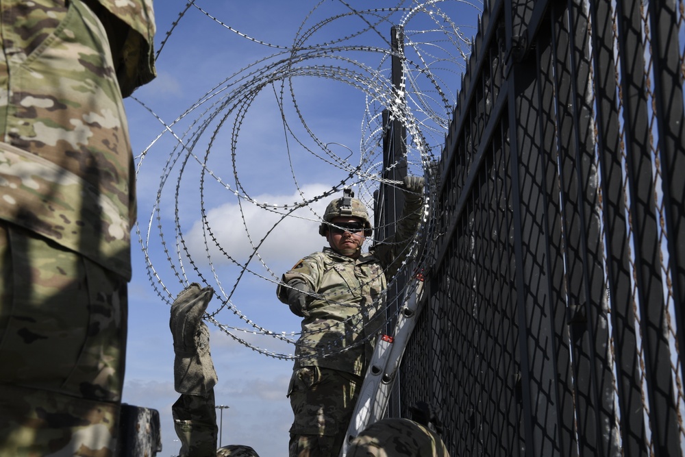 Soldiers install concertina wire for Anzalduas International Bridge