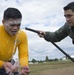 Hospital Corpsman renders aid to sailor during training exercise