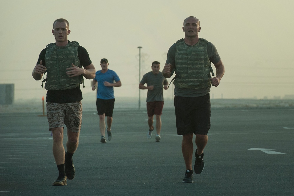 Service members test fitness during EOD 134 Memorial Workout