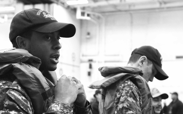 Sailor Dons Life Jacket