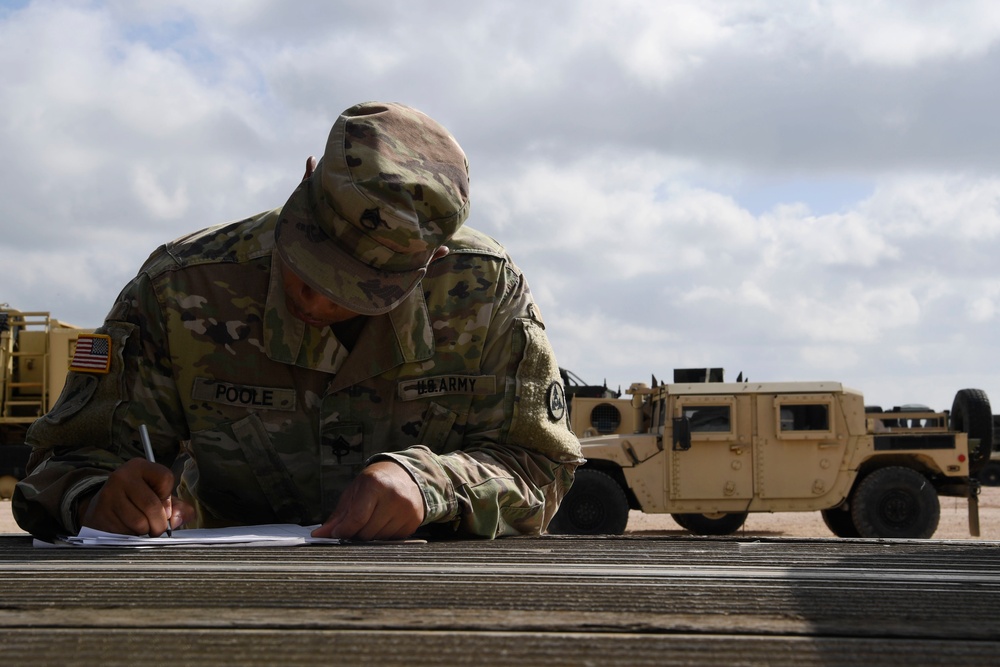 Soldier take inventory of delivered equipment