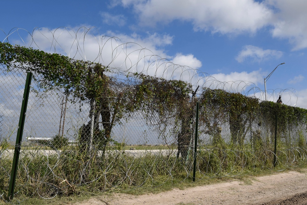 Soldier installs concertina wire