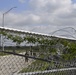 Soldiers install concertina wire