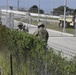 Soldiers install concertina wire