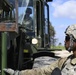 Soldiers install posts for concertina wire