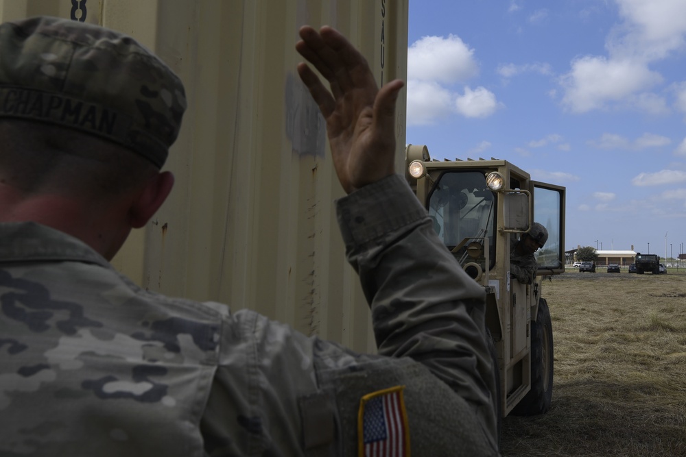 Soldiers move supply containers