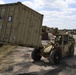 Soldier moves supply container