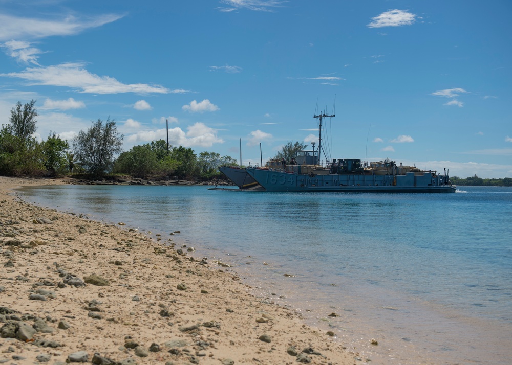 USS Ashland, Naval Beach Unit 7 and Guam Army National Guard work together in support of Super Typhoon Yutu relief.