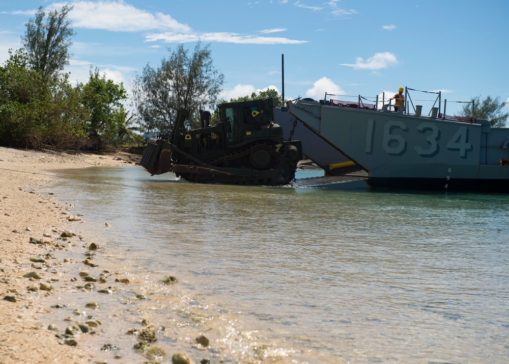 USS Ashland, Naval Beach Unit 7 and Guam Army National Guard work together in support of Super Typhoon Yutu relief.