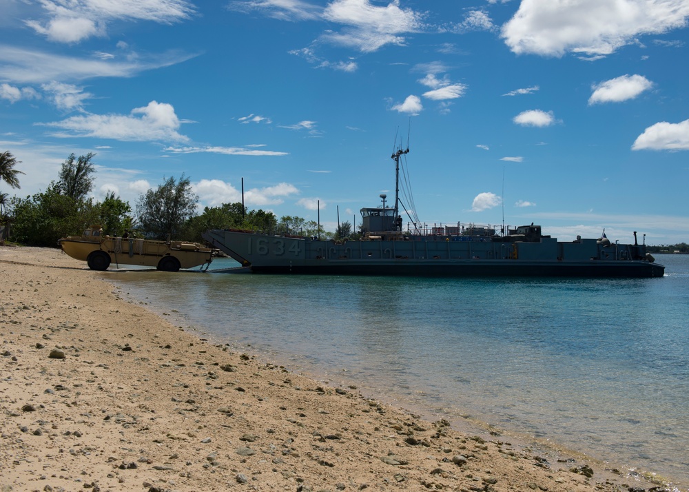 USS Ashland, Naval Beach Unit 7 and Guam Army National Guard work together in support of Super Typhoon Yutu relief.