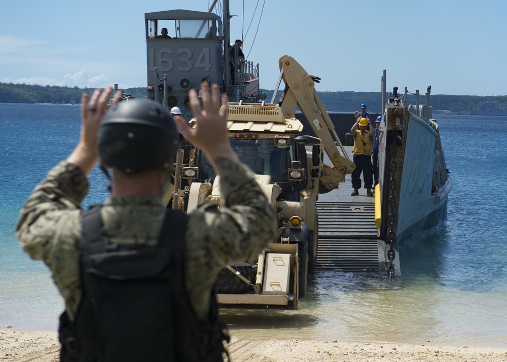 USS Ashland, Naval Beach Unit 7 and Guam Army National Guard work together in support of Super Typhoon Yutu relief.