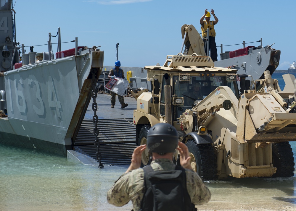 USS Ashland, Naval Beach Unit 7 and Guam Army National Guard work together in support of Super Typhoon Yuto relief.