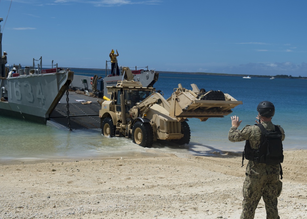 USS Ashland, Naval Beach Unit 7 and Guam Army National Guard work together in support of Super Typhoon Yutu relief.