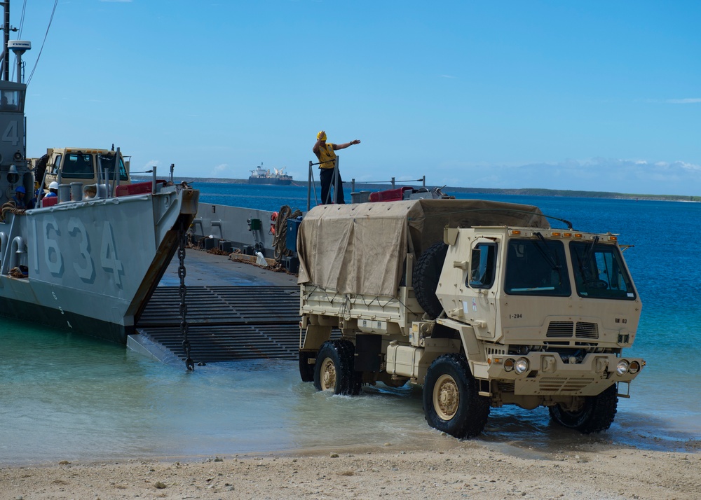 USS Ashland, Naval Beach Unit 7 and Guam Army National Guard work together in support of Super Typhoon Yutu relief.