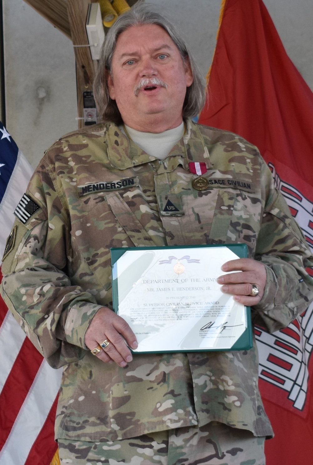 Henderson receives the Superior Civilian Service Award