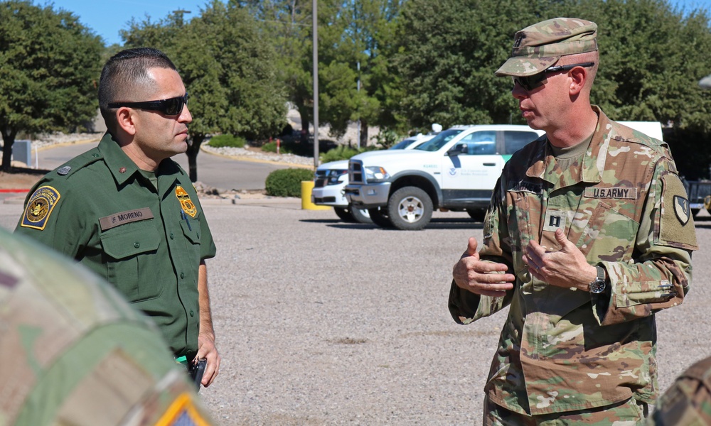 104th Engineer Construction Company install concertina wire