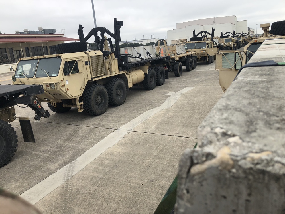 Army Trucks Move Barriers To Southern Texas