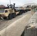 Army Trucks Move Barriers To Southern Texas