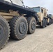 Army Trucks Carry Barriers To Southern Texas