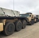 Army Trucks Carry Barriers To Southern Texas