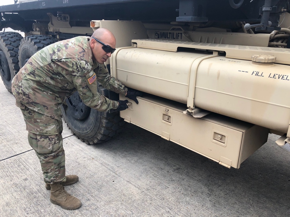 Army Trucks Carry Barriers To Southern Texas