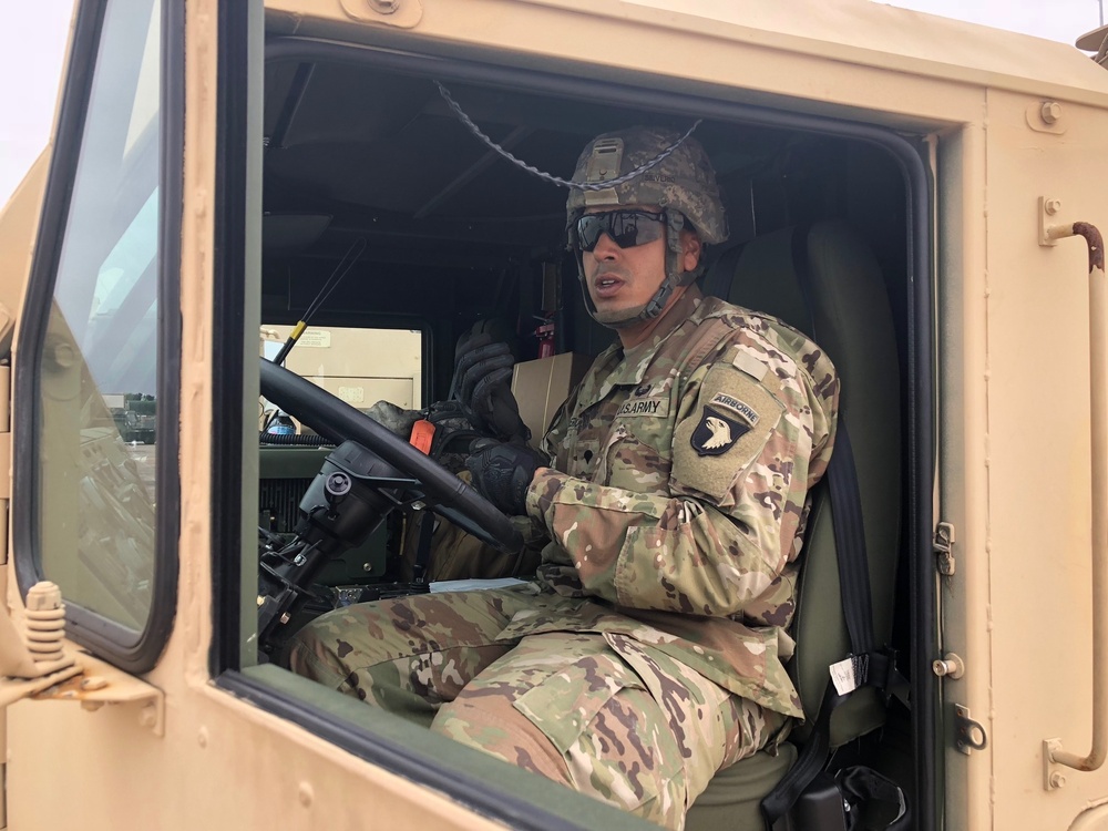 Army Trucks Carry Barriers To Southern Texas