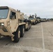 Army Trucks Carry Barriers To Southern Texas