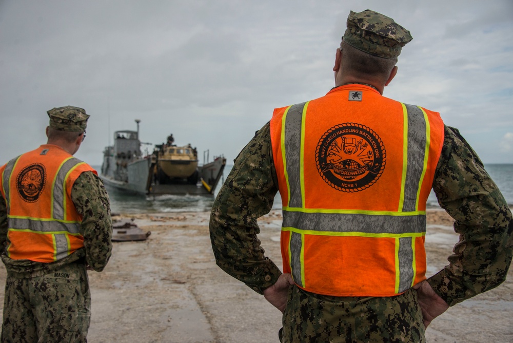 Military Transports Heavy Equipment Vehicles to Saipan in Response to Super Typhoon Yutu