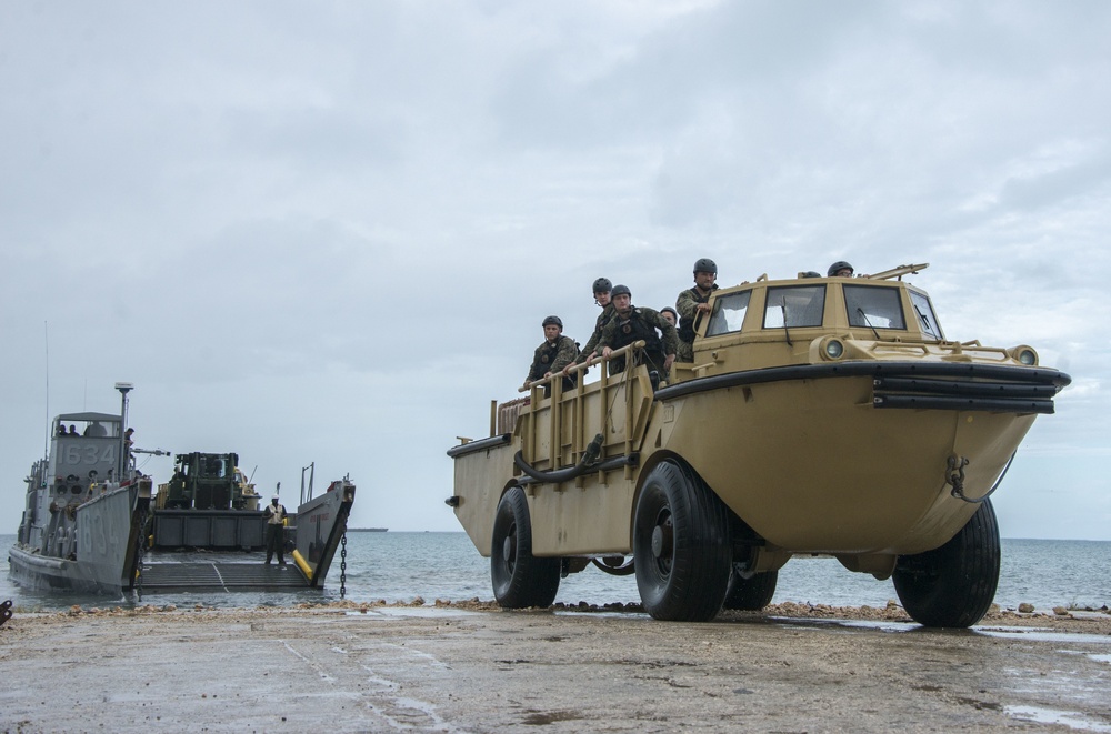 Military Transports Heavy Equipment Vehicles to Saipan in Response to Super Typhoon Yutu