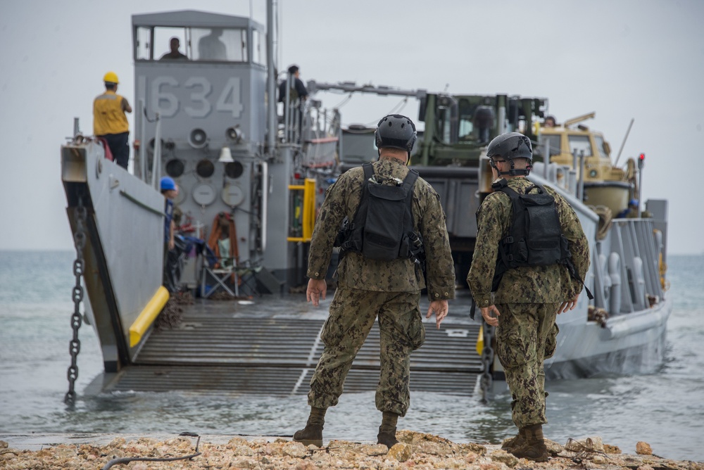 Military Transports Heavy Equipment Vehicles to Saipan in Response to Super Typhoon Yutu