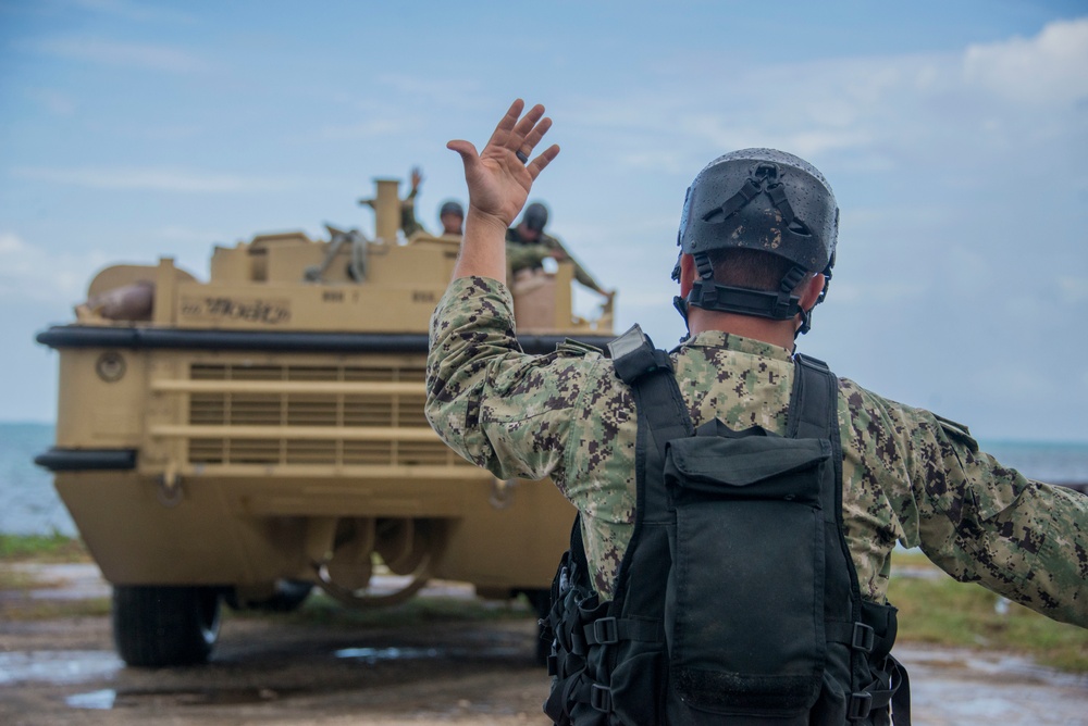 Military Transports Heavy Equipment Vehicles to Saipan in Response to Super Typhoon Yutu